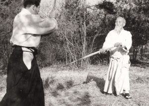 Morihei Ueshiba training outdoors in Iwama with Morihiro Saito, c. 1958