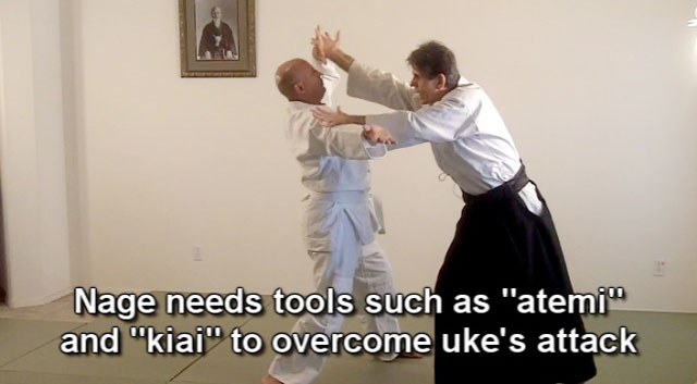 The simultaneous execution of atemi and kiai to disrupt uke's attack