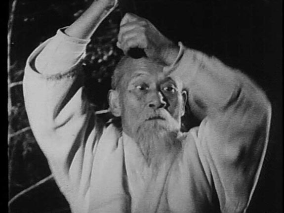Night training with the bokken in Iwama, 1961