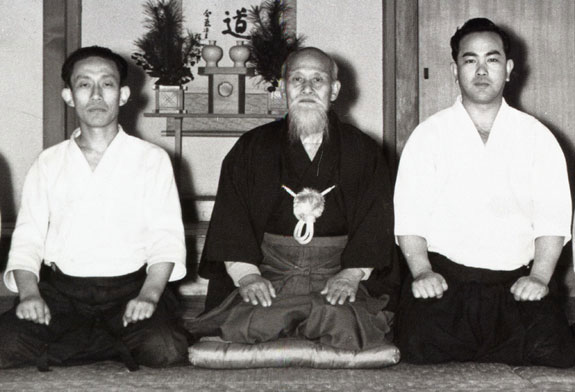 Left to right: Kisshomaru Ueshiba, Morihei Ueshiba, and Koichi Tohei, c. 1957