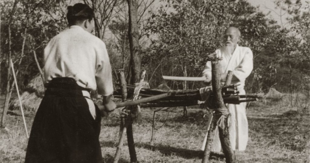 Morihiro Saito training with Founder Morihei Ueshiba in the fields of Iwama c. 1955