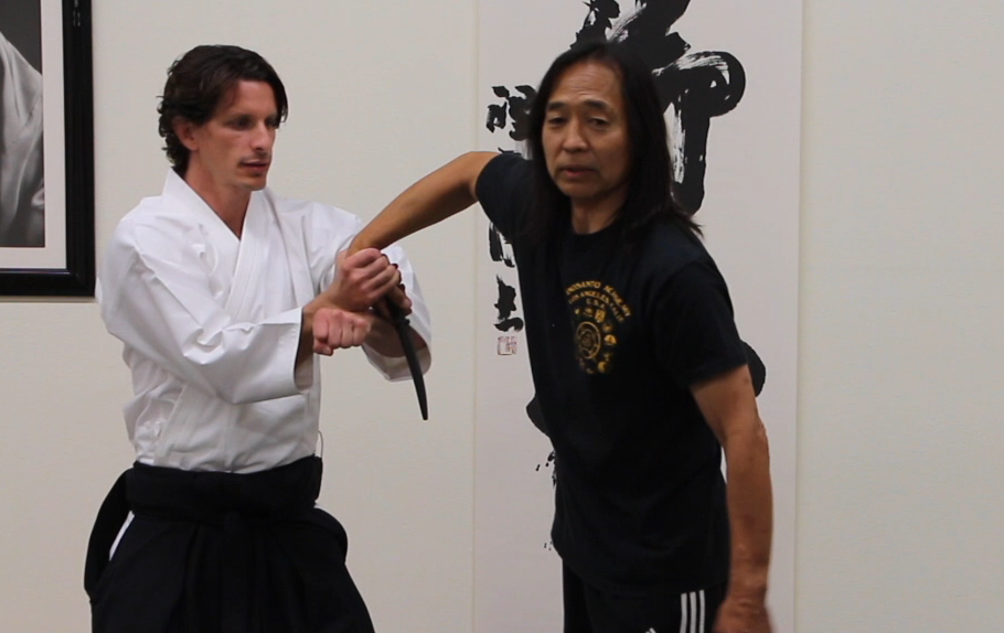 Josh gets to a successful disarm position after using hand movements to clear two prior attacks.
